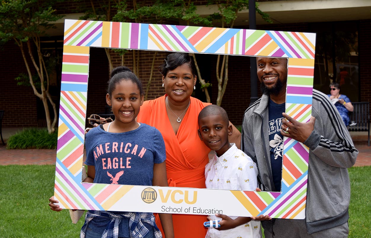 Dr. Cassandra Willis and her family at the Spring 2019 Graduation Reception in Oliver Hall Courtyard.