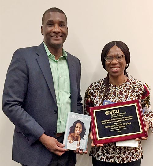 Dr. Jeffery Wilson, associate professor in the Department of Educational Leadership, and doctoral candidate Emiola Oyefuga with her 2019 Black History in the Making award.