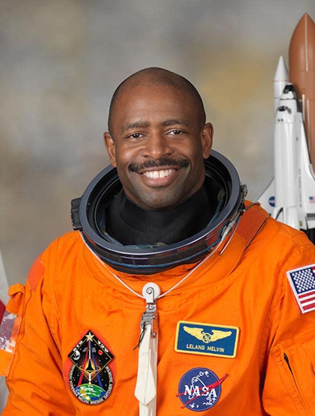 Leland Melvin orange space suit