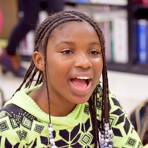 A student from Barack Obama Elementary School at the Fall 2019 Pen Pal Pairs event at Oliver Hall.