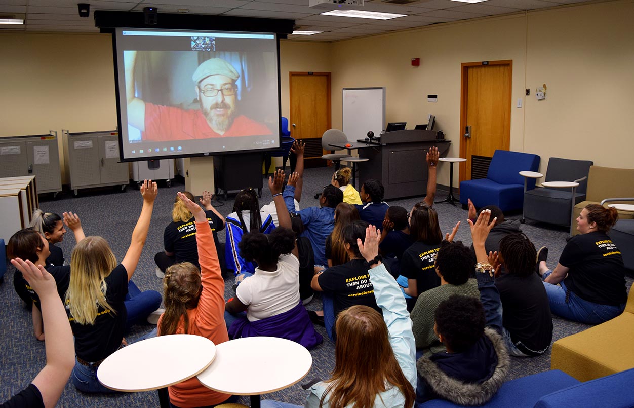 Children's book author Josh Funk conducts a Skype question and answer session with fifth-grade students from Barack Obama Elementary School in Oliver Hall.