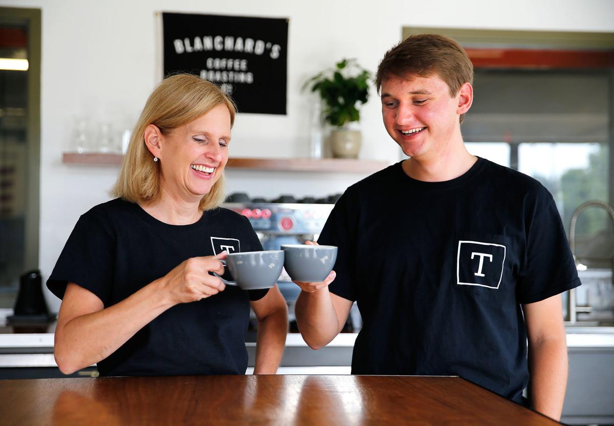 Chesterfield County special education teacher Kari Lee and her son, University of Miami student Collin Lee, taste coffee at Blanchard's Coffee Roasting Co. in Richmond. They plan to open a coffee shop called Thrive in Midlothian. (MARK GORMUS/TIMES-DISPATCH)