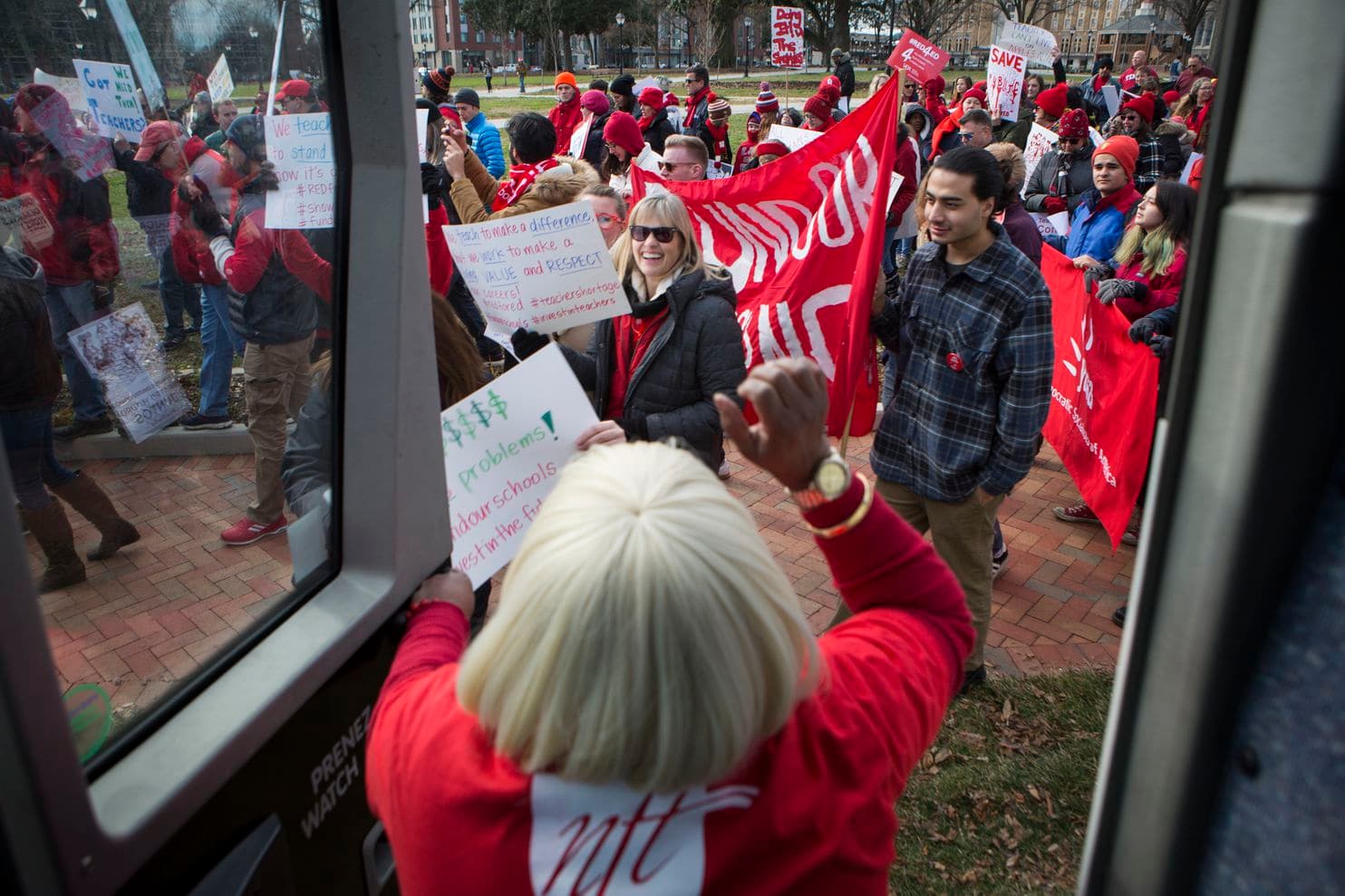 Donnetta Russell, a clerk specialist at Norview Middle School in Norfolk, cheered on educators in January as they called for more money for schools at the Virginia State Capitol. (Julia Rendleman/For The Washington Post)