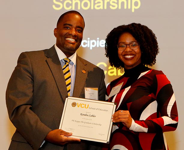 Dean Andrew Daire presents a scholarship to student Kendra Cabler at the 2018 SOE Scholarships and Awards Ceremony.