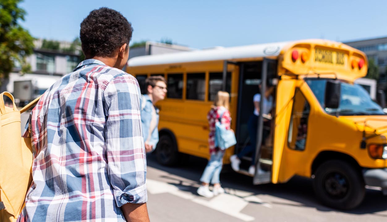 Students board a school bus. (Getty Images)
